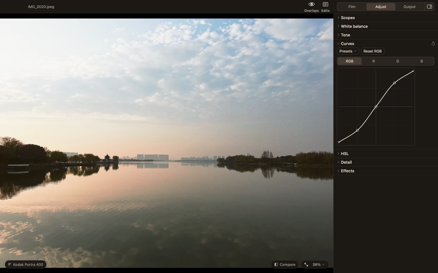 Milkglass showing a misty lake with the Curves section open in the Adjust page.